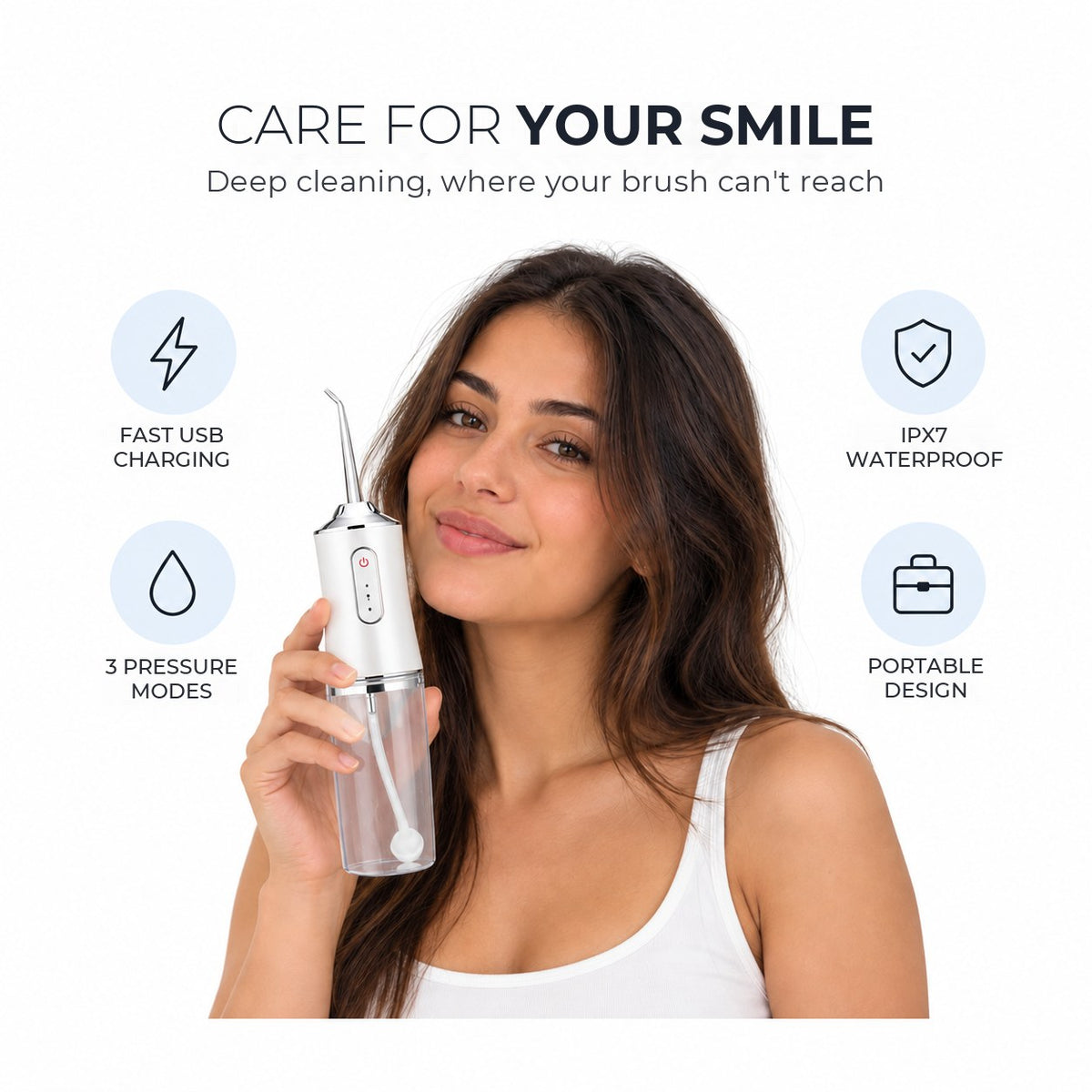 Woman holding the Sulavelle portable water flosser